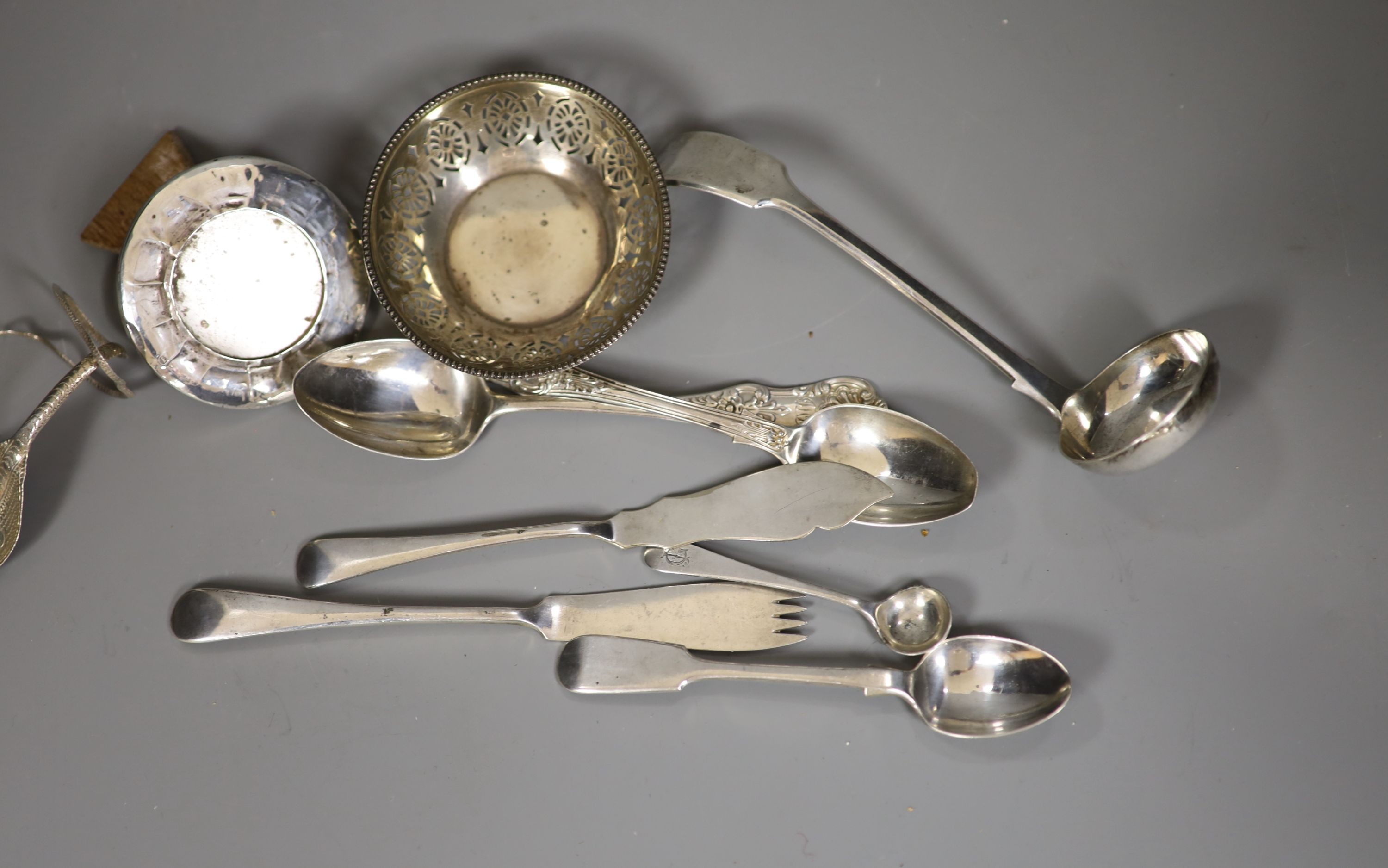 A Victorian silver fiddle pattern sauce ladle, two Victorian Scottish silver teaspoons, a pierced silver small bowl, small silver mounted photograph frame and thirteen other items including silver plated miniature animal